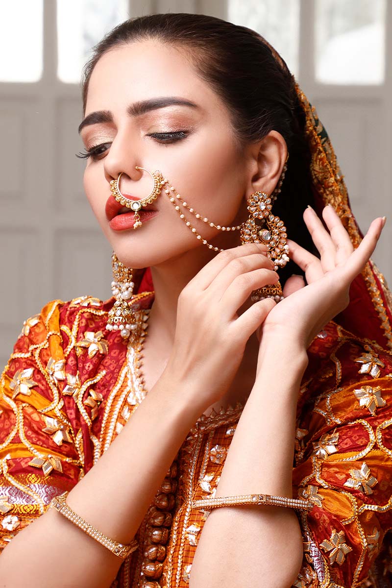 Mustard & red short shirt gharara set with gota-detailed dupatta.